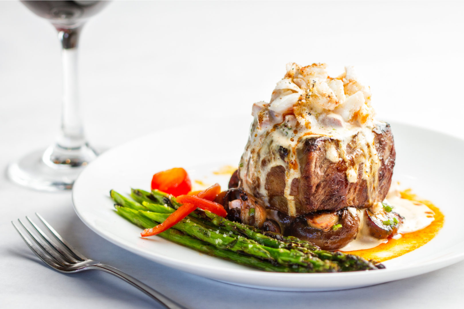 A plated meal of steak and crab meat