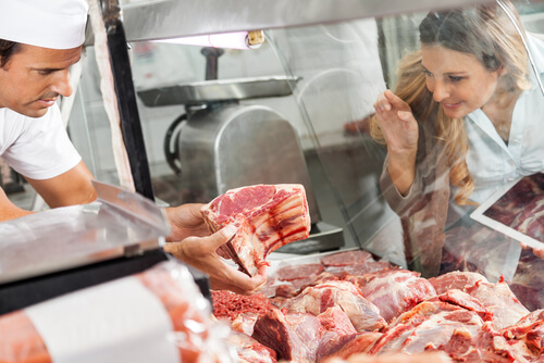 Women order USDA Prime cut steak from butcher